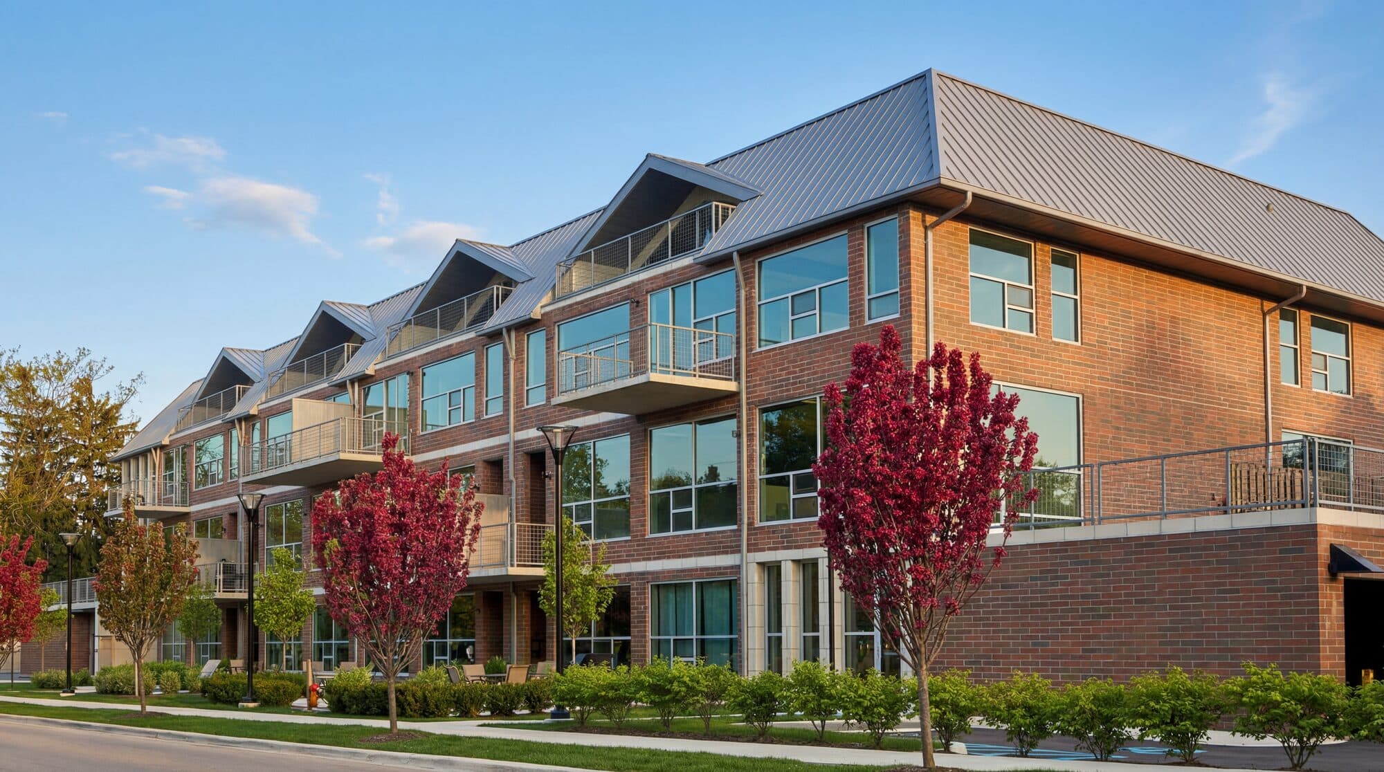 300 Hamilton front elevation showing brick facade and floor-to-ceiling glass storefronts in Plymouth Michigan