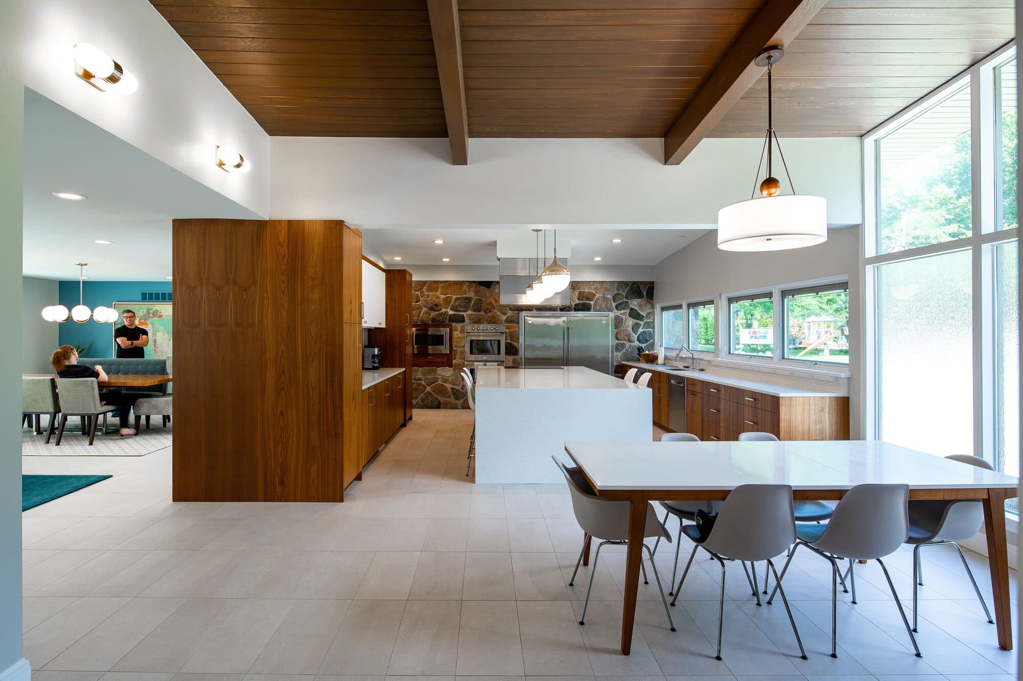 Kitchen and dining area with clean lines and connection to outdoor living spaces