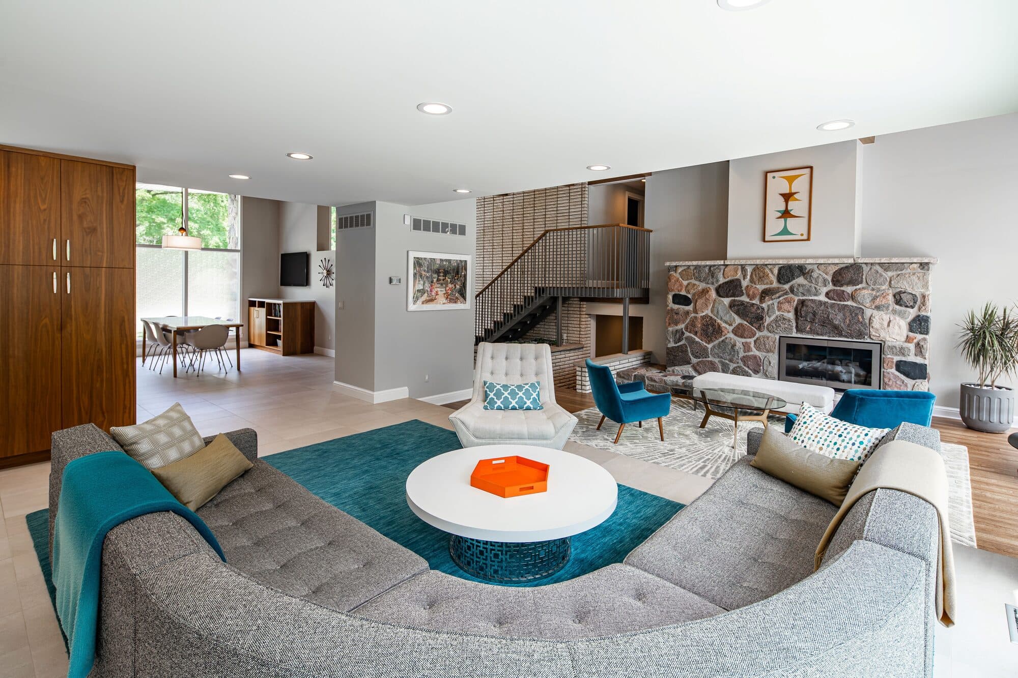Lounge area with original fireplace and restored mid-century details