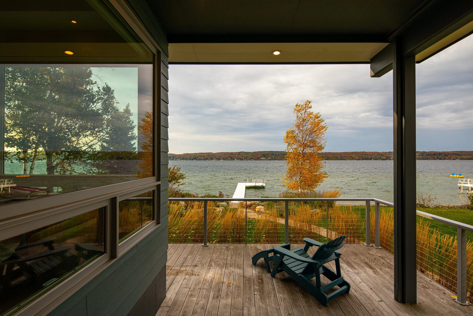 Lake Charlevoix home exterior showing natural materials and connection to the waterfront landscape